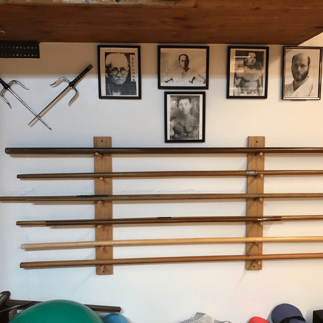 The Mountain Karate, Castro Valley Dojo. Bows and images of Sensei Lushington's lineage of teachers.